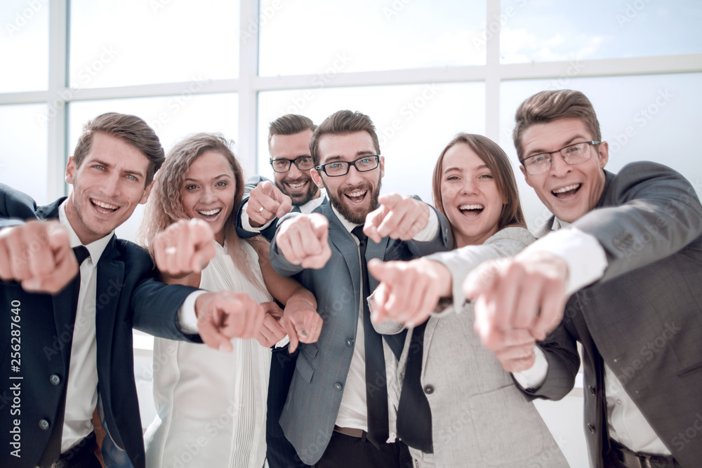 Obraz premium close up. successful business team pointing at you.