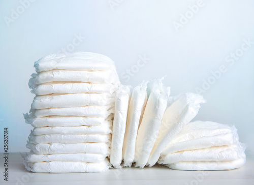 Photographie Stack of baby diapers on table.