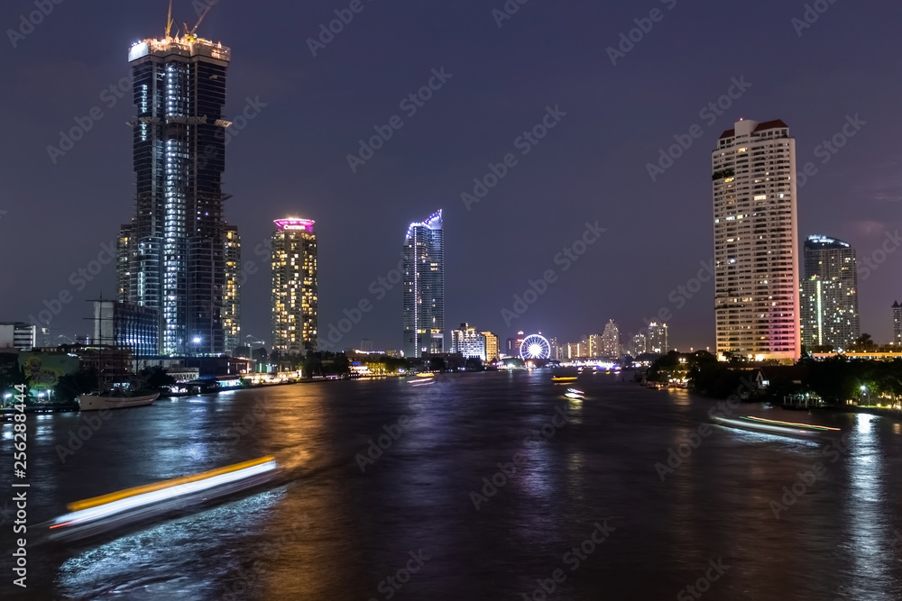 Fototapeta premium Cityscape, Panorama At Night Of Bangkok Side by Side Riverside, Chao Phraya Beautiful Color light ,of Thailand 2019