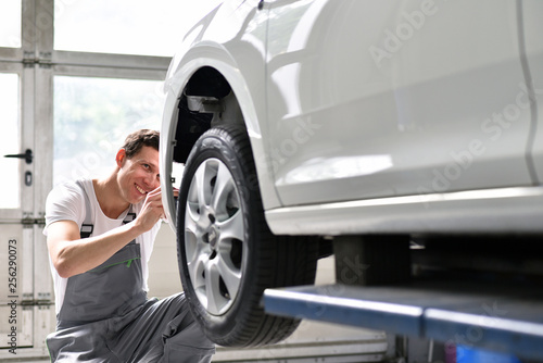car mechanic repairs car bodywork of a vehicle after a traffic accident