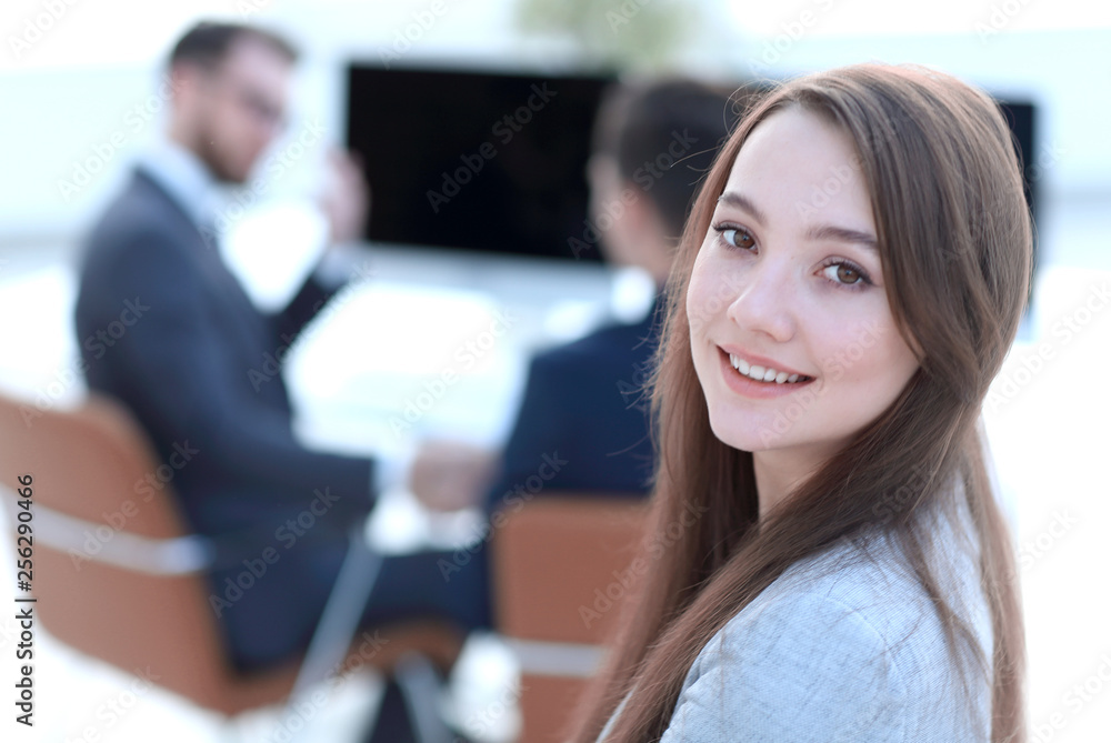 smiling female assistant in the background of the office smiling female assistant in the background of the office
