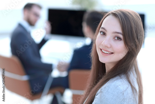 Wallpaper Mural smiling female assistant in the background of the office Torontodigital.ca