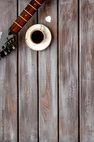 Professional dj instruments with guitar and coffee on wooden background top view mockup