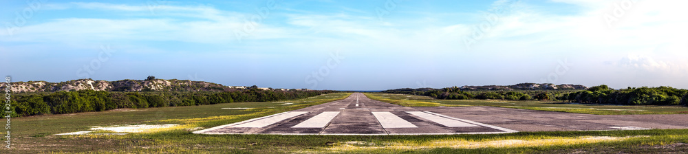 The runway of the airport of the Assumption island in Seychelles