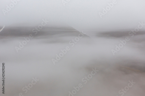 Under heavy fog mountains are hardly visible, Svalbard, Spitzbergen, Longyearbyen, Norway
