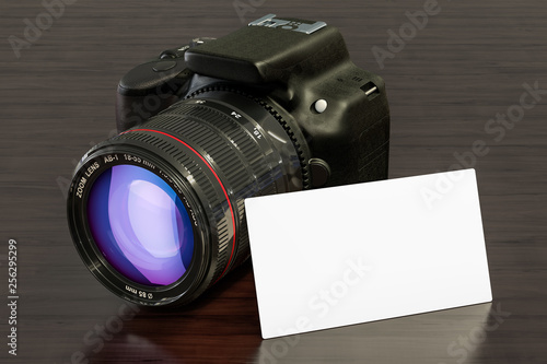 Blank business card with digital camera on the wooden desk background. 3D rendering photo