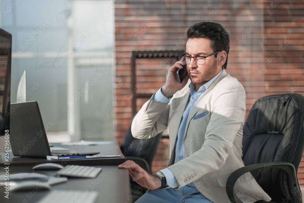 businessman talking on a mobile phone businessman talking on a mobile phone