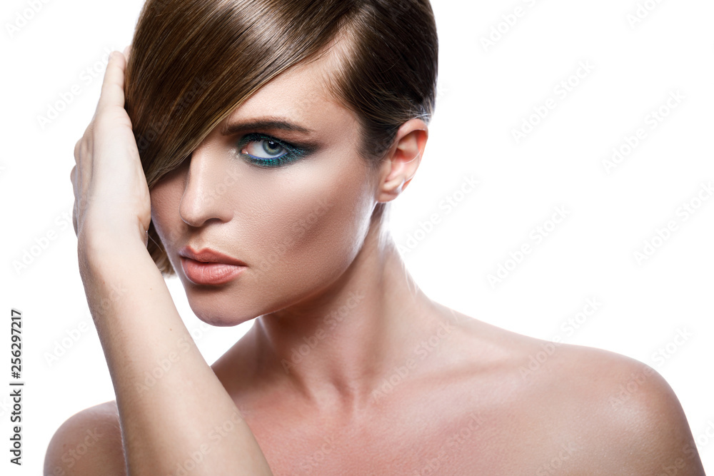 Model in stylish image with sleek hair covering one eye Model in stylish image with sleek hair covering one eye