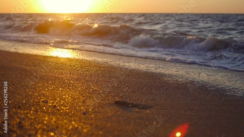 Storm at sea in sunset. Beautiful sunshine on water