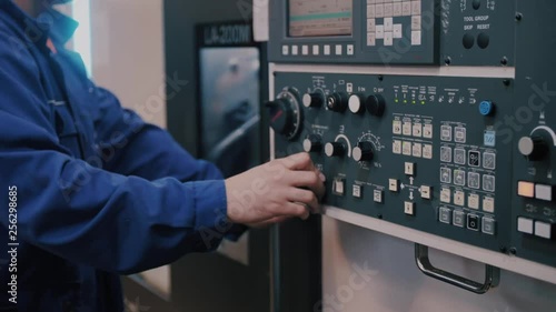 Macro control unit CNC machines and workers finger sets the program command