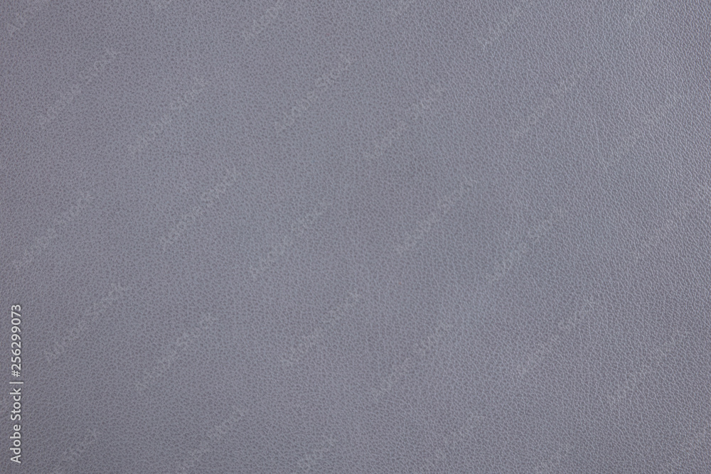 Background with greyish lilac artificial leather, close up – photo image