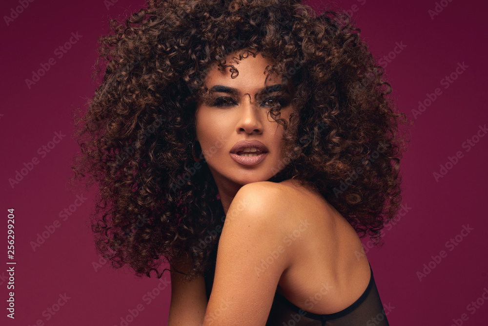 portrait of curly model on bright background portrait of curly model on bright background