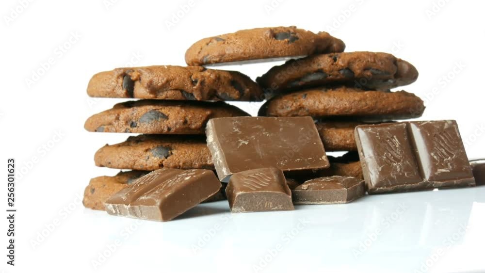 Chocolate cookies on a stylish white background and a mirror surface Chocolate cookies on a stylish white background and a mirror surface