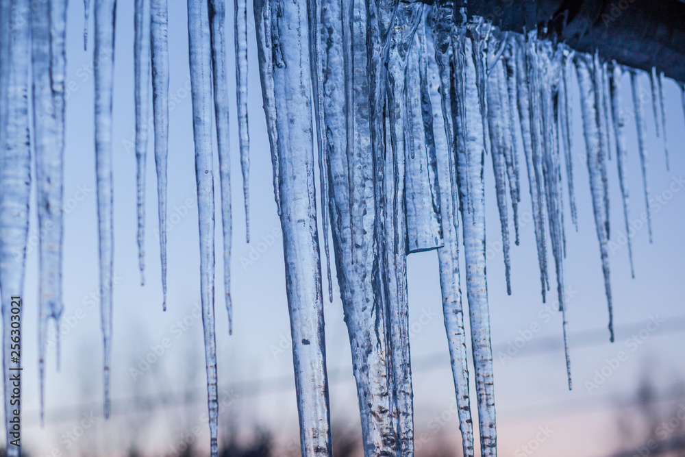 some icicles hanging an the roff at spring some icicles hanging an the roff at spring