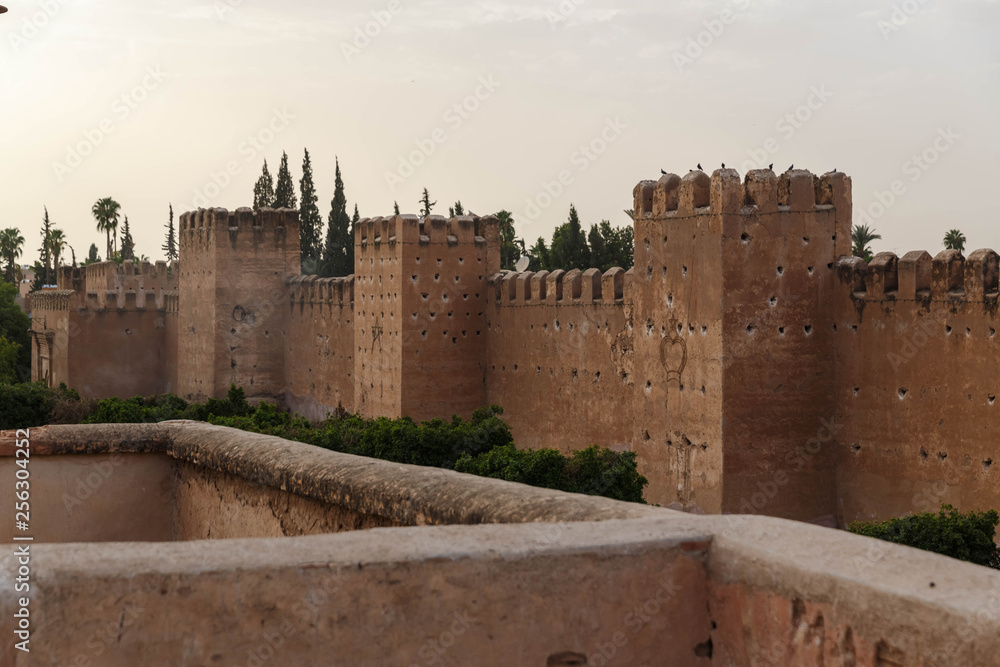 Taroudant old medieval defensive wall and palms alley, Morocco
