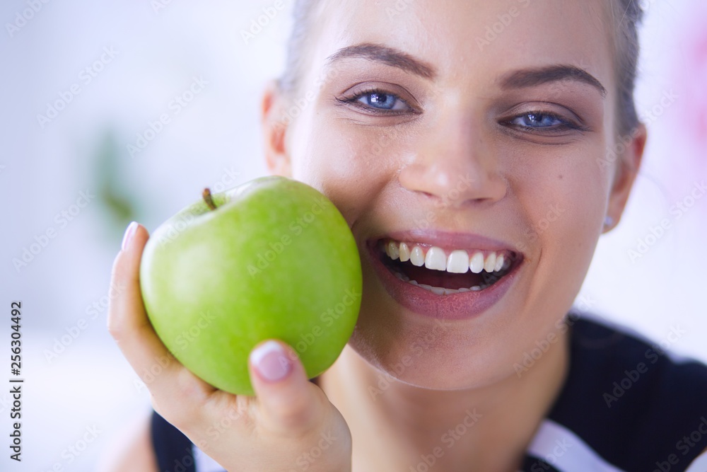 Close up portrait of healthy smiling woman with green apple. Close up portrait of healthy smiling woman with green apple.
