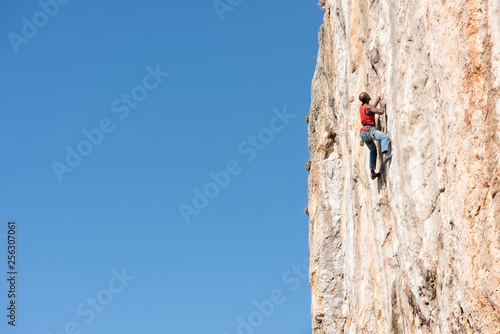 Greece, Kalymnos, climber in rock wall