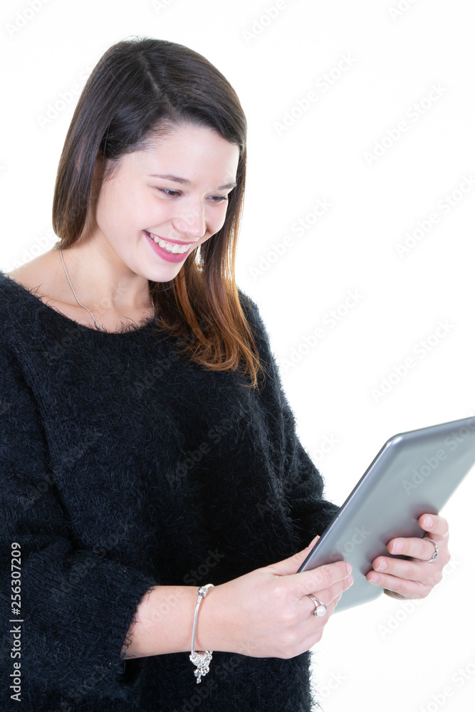 Woman smiling using digital tablet computer PC isolated on white background Woman smiling using digital tablet computer PC isolated on white background
