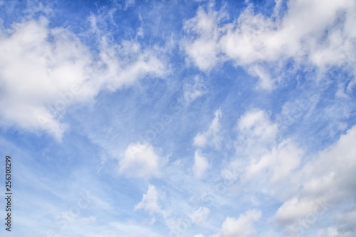Blue sky with cirro cumulus and puffy white clouds. Sky background