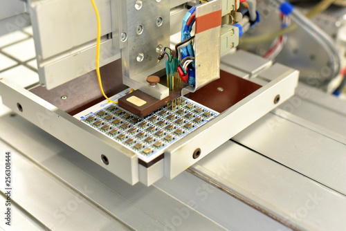 Close-up of loading of circuit boards in a factory