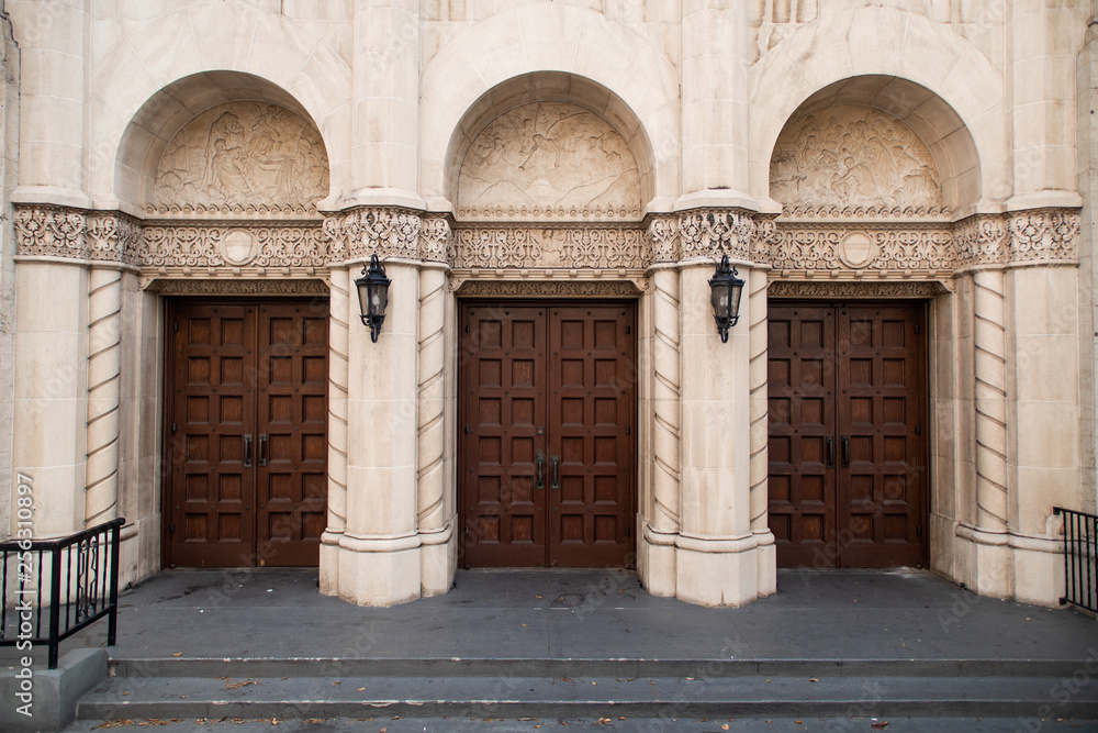 Historic entrance with three large wooden doors
