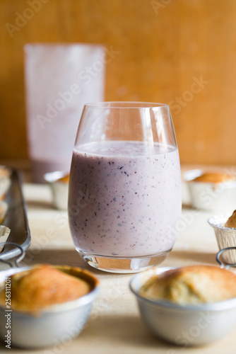 Blueberry smoothies with lactose free almond milkbanana muffins, concept for healthy breakfast and snack. photo