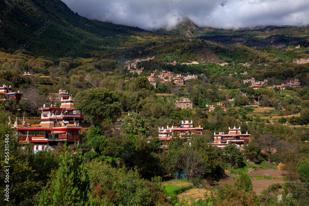 Fototapeta premium Danba County, Sichuan Province China. Zhonglu Township, Architectural Style of Jiuaju Ancient Tibetan Village. Traditional Tibetan buildings, Suopo towers, beautiful Chinese countryside. Wild West