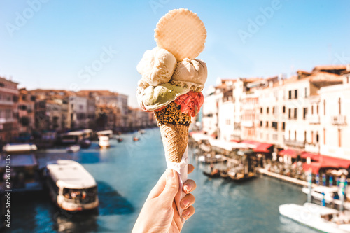 Delicious icecream in beautiful Venezia, Italy in front of a canal and historic buildings