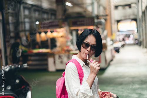 Asian woman traveling and smoking