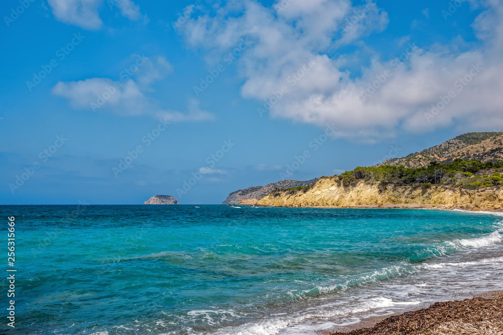 Beautiful small bay with crystal clear turquoise sea water on coast of Rhodes island, Greece. Beautiful small bay with crystal clear turquoise sea water on coast of Rhodes island, Greece.
