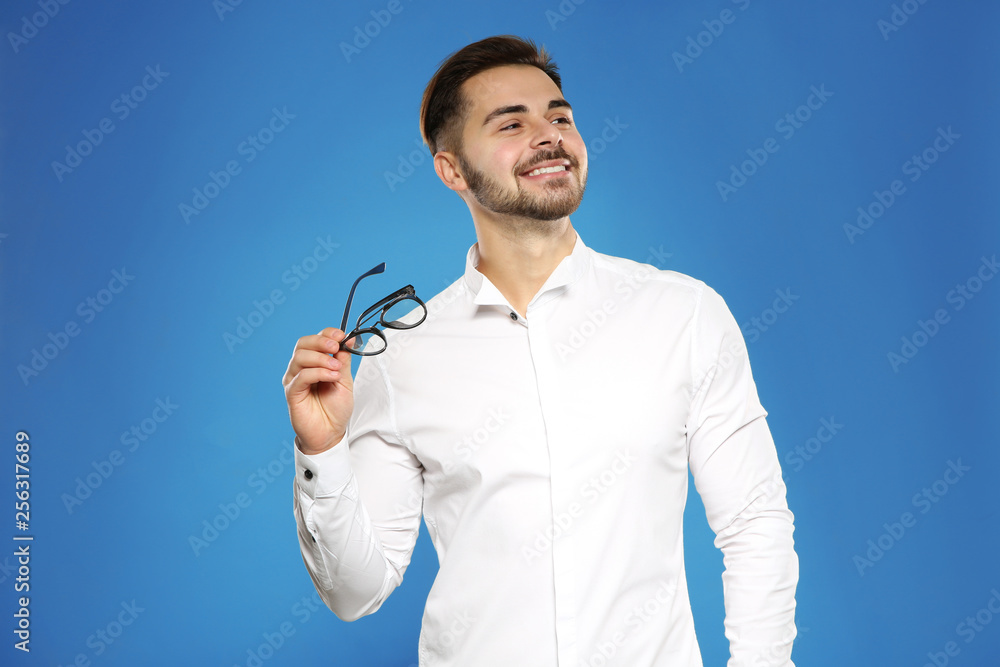 Portrait of handsome young man with glasses on color background Portrait of handsome young man with glasses on color background