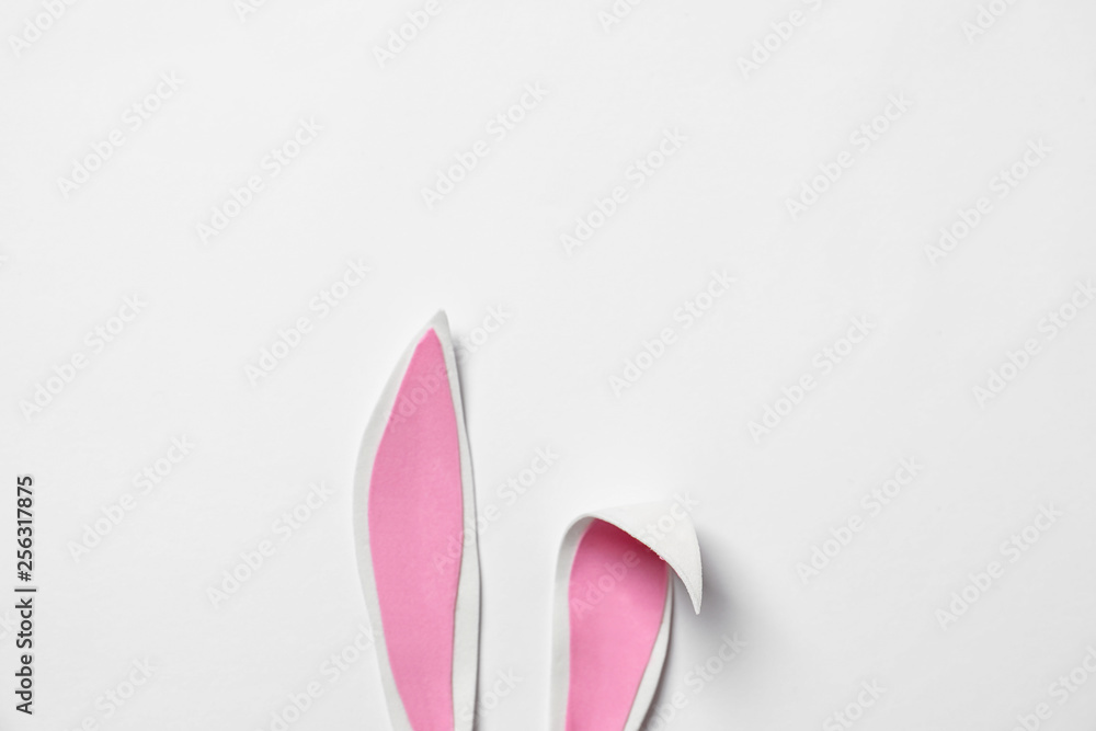 Funny Easter bunny ears on white background, top view Funny Easter bunny ears on white background, top view