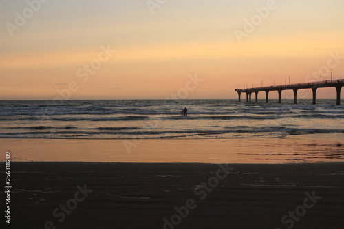 Surfing at sunrise © Bret