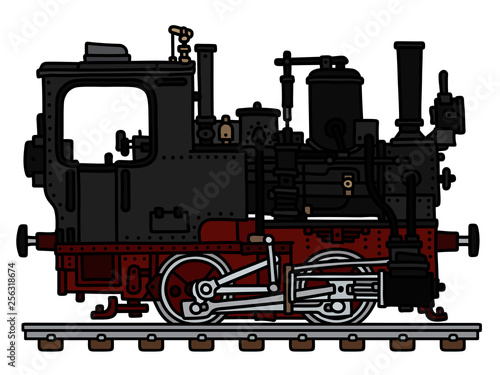 The vectorized hand drawing of an old black small steam locomotive