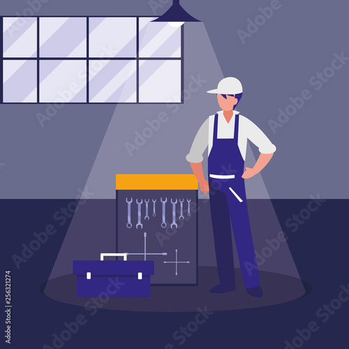 mechanic worker with tools board hanging