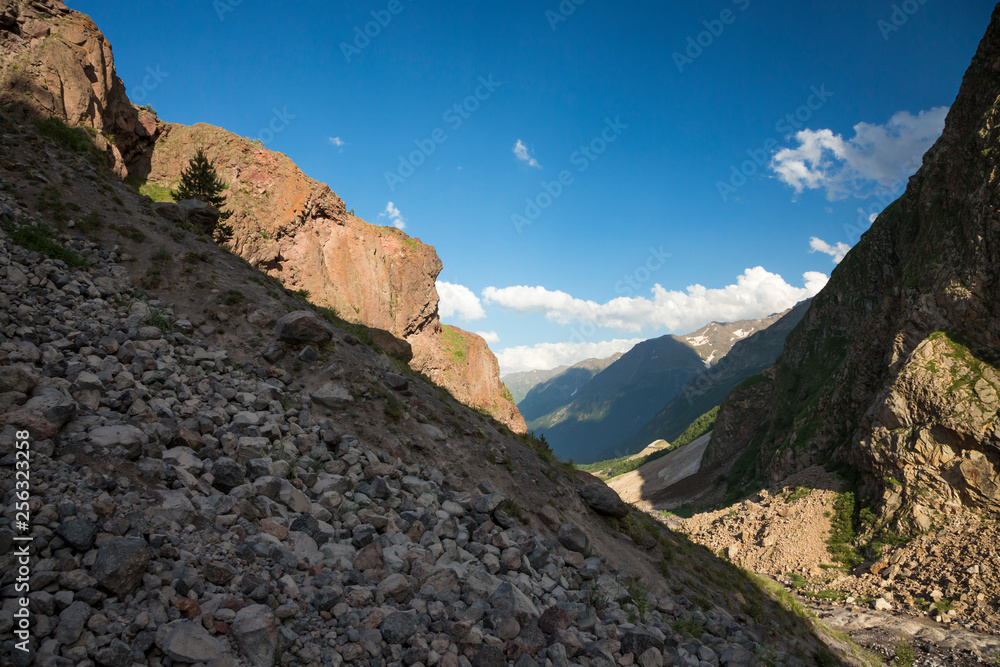 Mountains and the nature of the North Caucasus, the blue sky over high rocks in the beautiful gorge