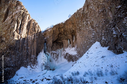 Winter falls in mountain rocks  the wild nature of the North Caucasus