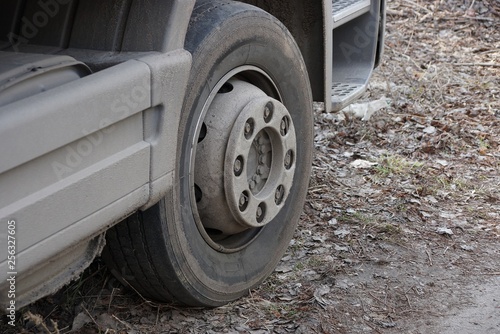 big gray wheel on the truck is on the road