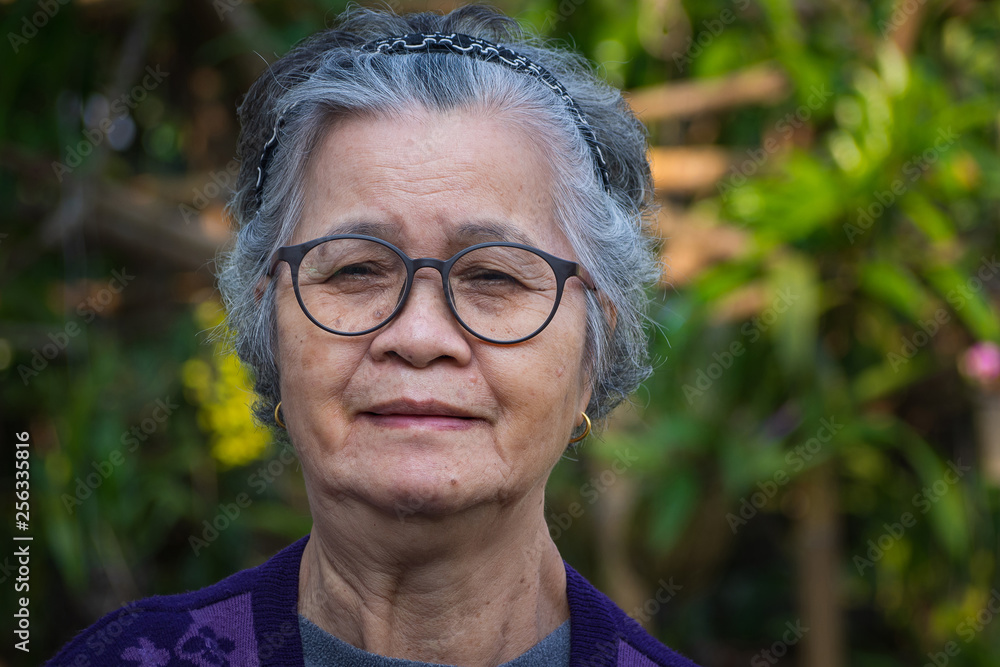 Portrait of a senior woman in her garden. Portrait of a senior woman in her garden.