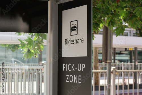 Black and white rideshare pick up zone sign photo