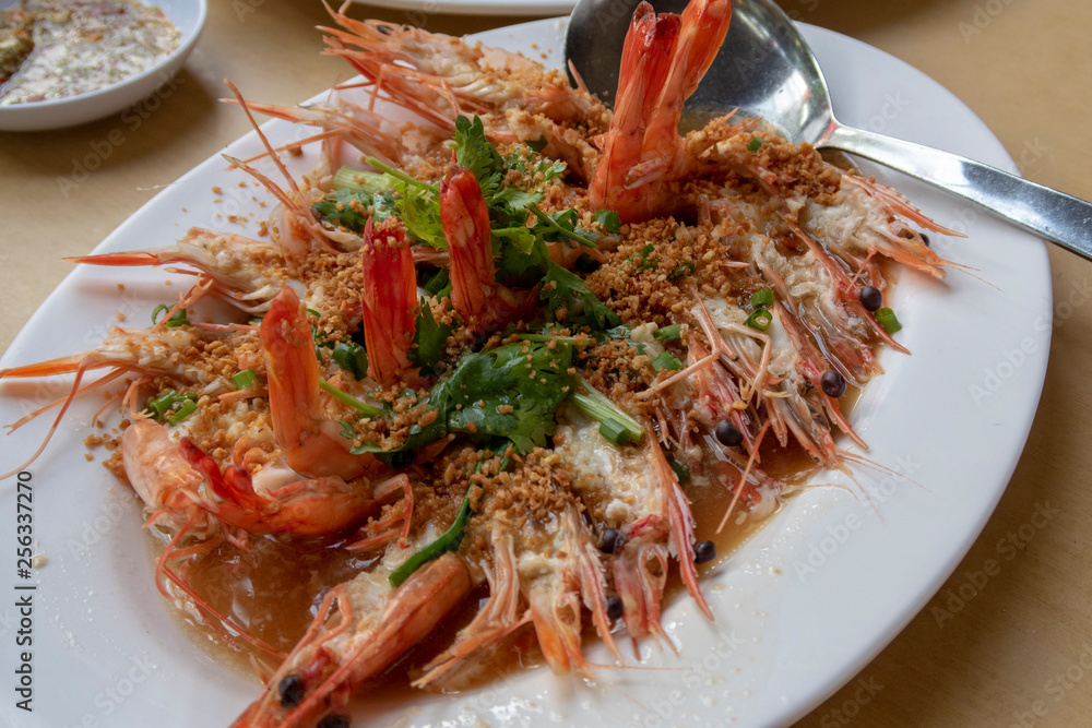 Prawns cooked in garlic, a popular dish in seafood restaurants in Singapore Prawns cooked in garlic, a popular dish in seafood restaurants in Singapore