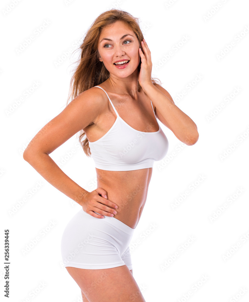 Young beautiful blonde woman in white fitness clothing Young beautiful blonde woman in white fitness clothing