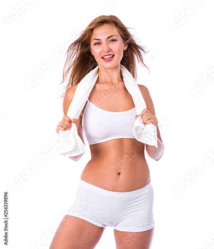 beautiful blonde woman in white fitness clothing © Andrey_Arkusha