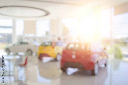 Blur the background of the car and Showroom at blurred in workplace or abstract background of shallow office.