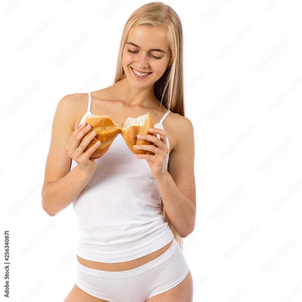 Young beautiful blonde woman in white fitness clothing