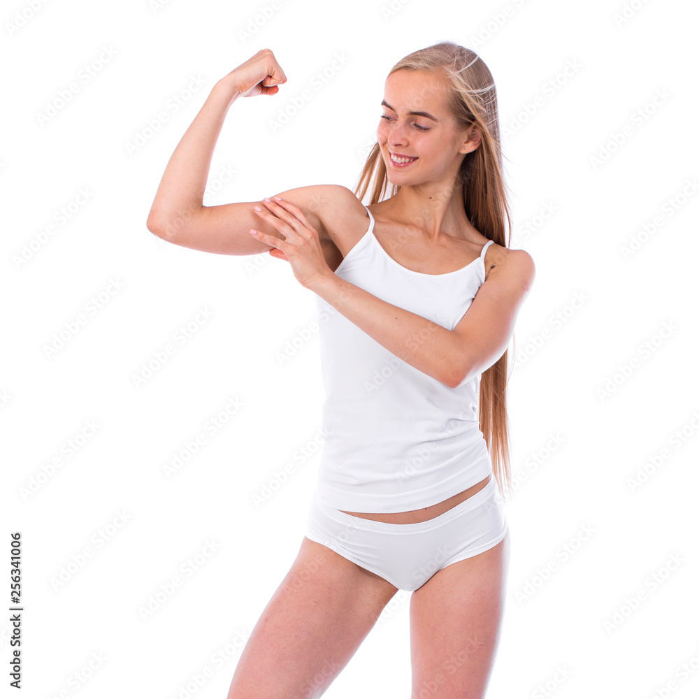 Young beautiful blonde woman in white fitness clothing Young beautiful blonde woman in white fitness clothing