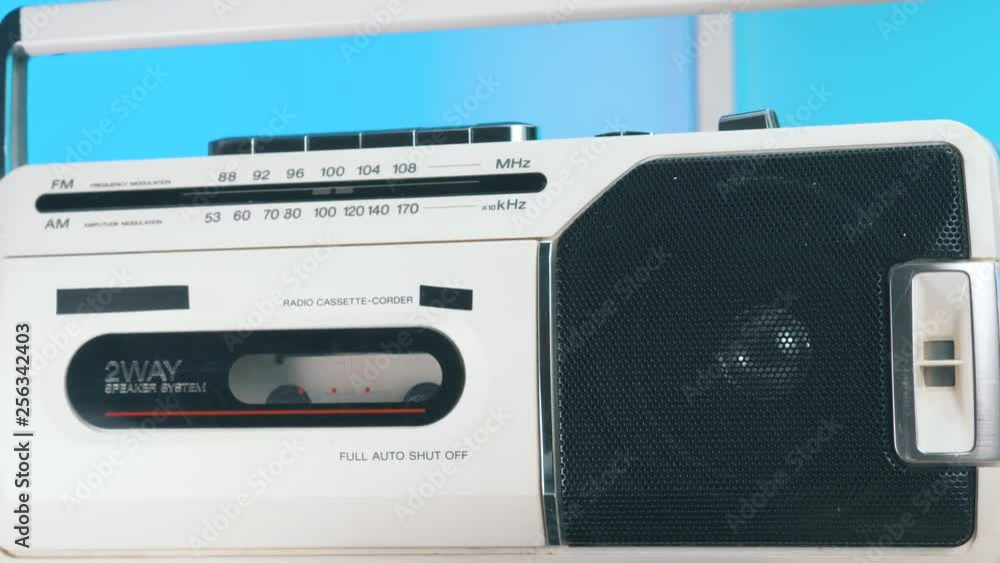 Cool white Radio with cassette player integrated closeup. 1980 1990 era technology. Cool white Radio with cassette player integrated closeup. 1980 1990 era technology.