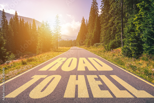 Принти на полотні Road to hell written on the street in the mountains