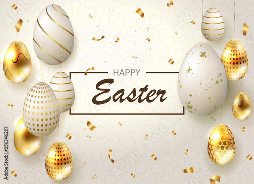 Easter light composition with eggs on pendants and scraps of golden ribbons,
