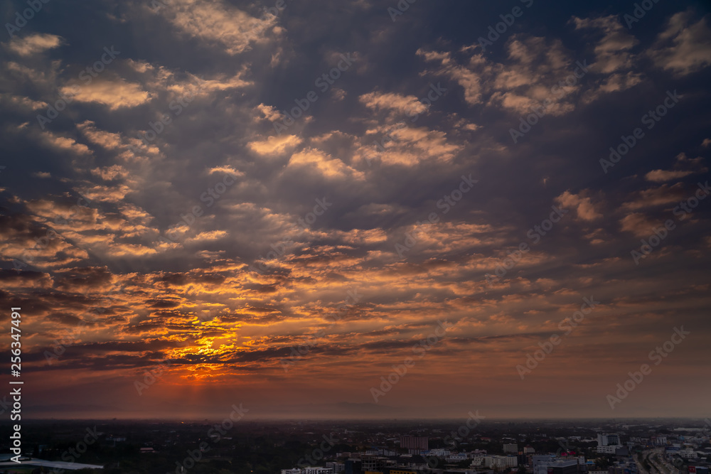 Naklejka premium Sunset over buildings in center of Chiang Mai, Thailand. Colorful Sunset with CityScape.